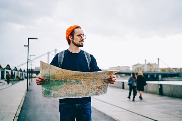 man looking at map