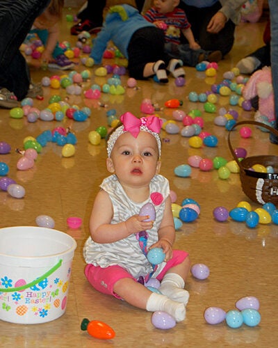 Baby with Easter eggs