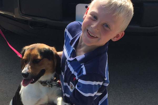 Young boy reunited with his puppy