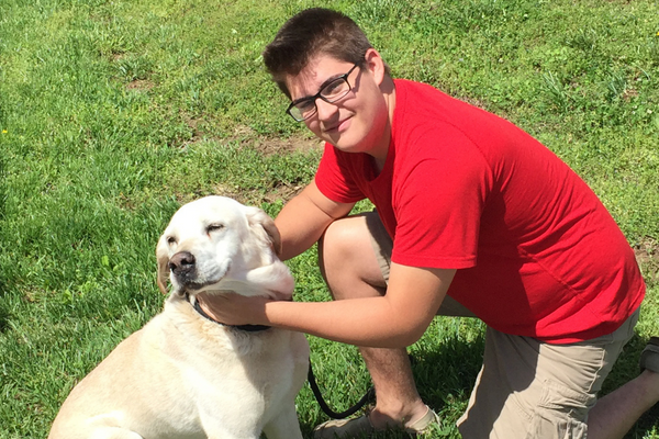 Teen boy reunited with his lab