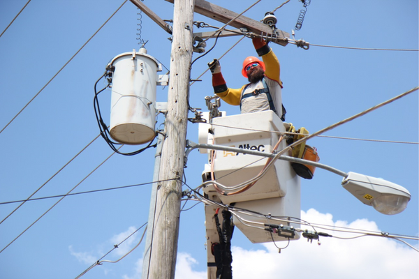 line worker up in bucket truck