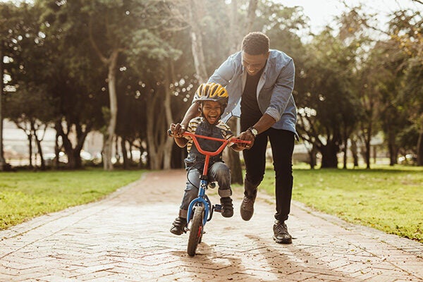 Kid Rides Bike