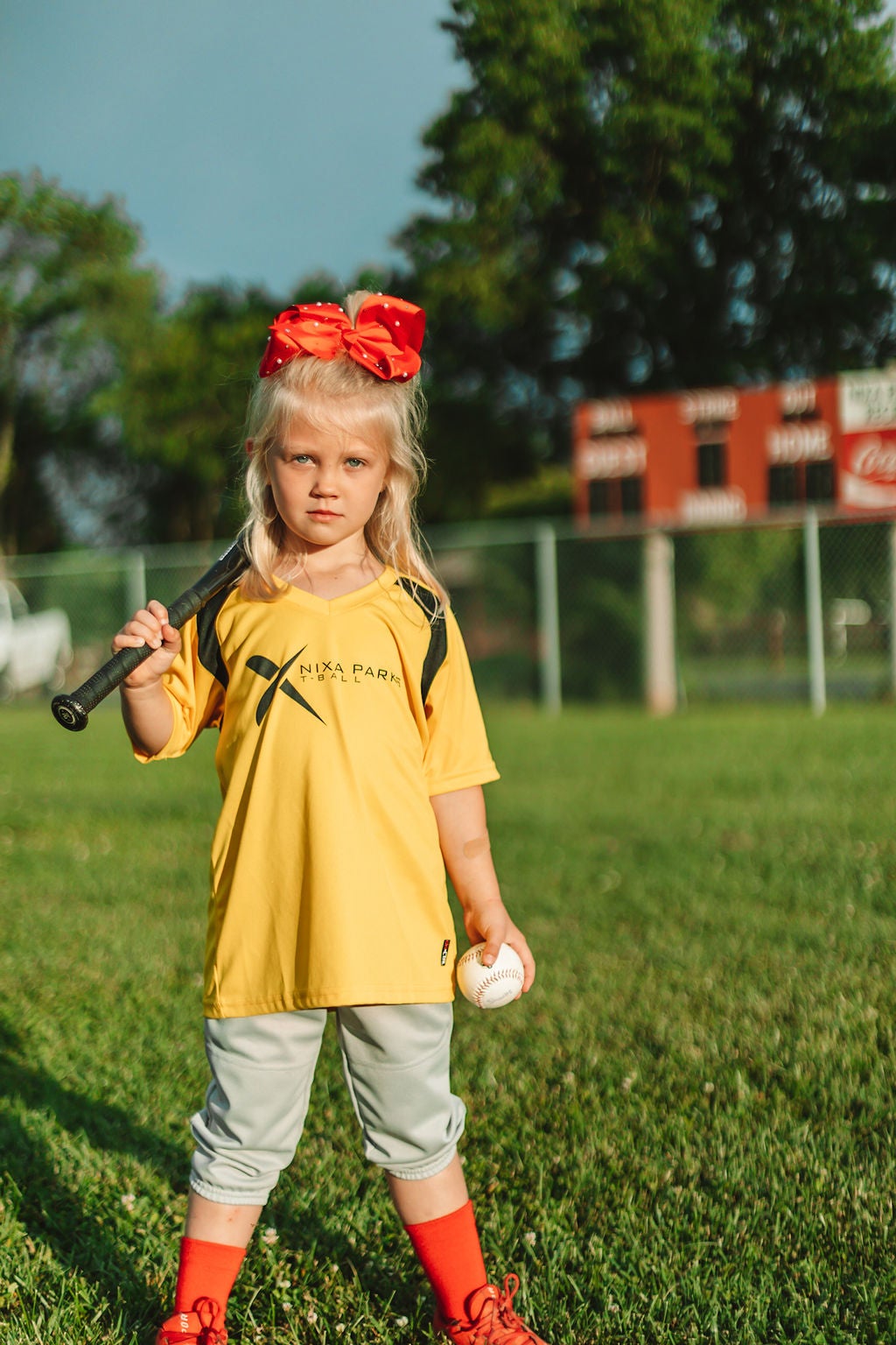 girl in softball uniform