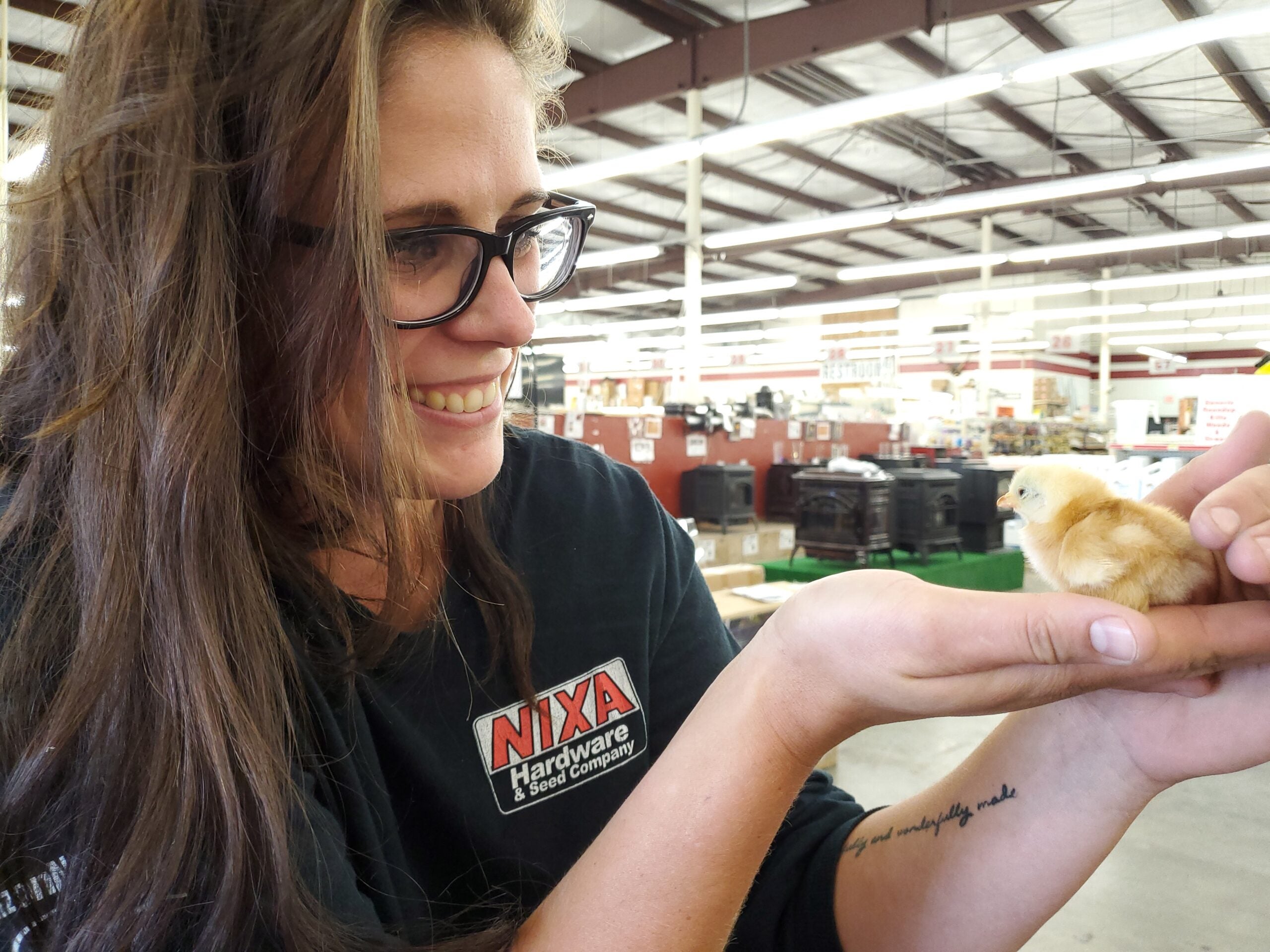 woman holding chick