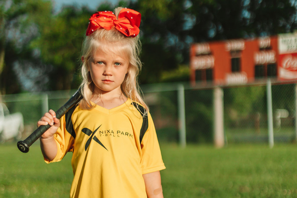 Girl holding baseball bat