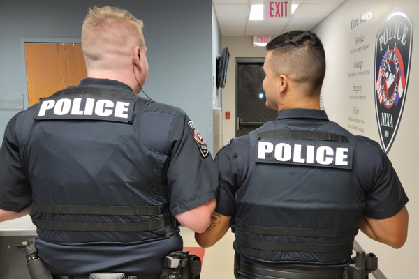 Two Officers with their back to us