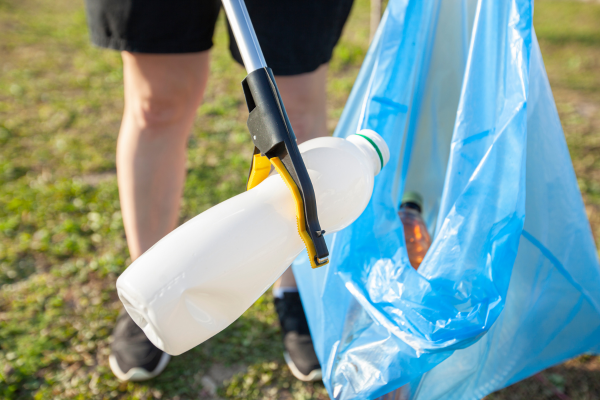 person picking up trash